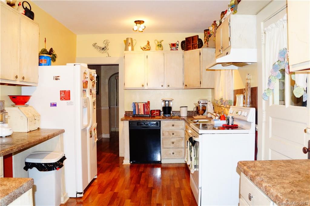 1396 Springdale Road, Unit 4/A Lancaster, SC 29720 - Photo 2 of 23 a view of a kitchen with fridge and workspace