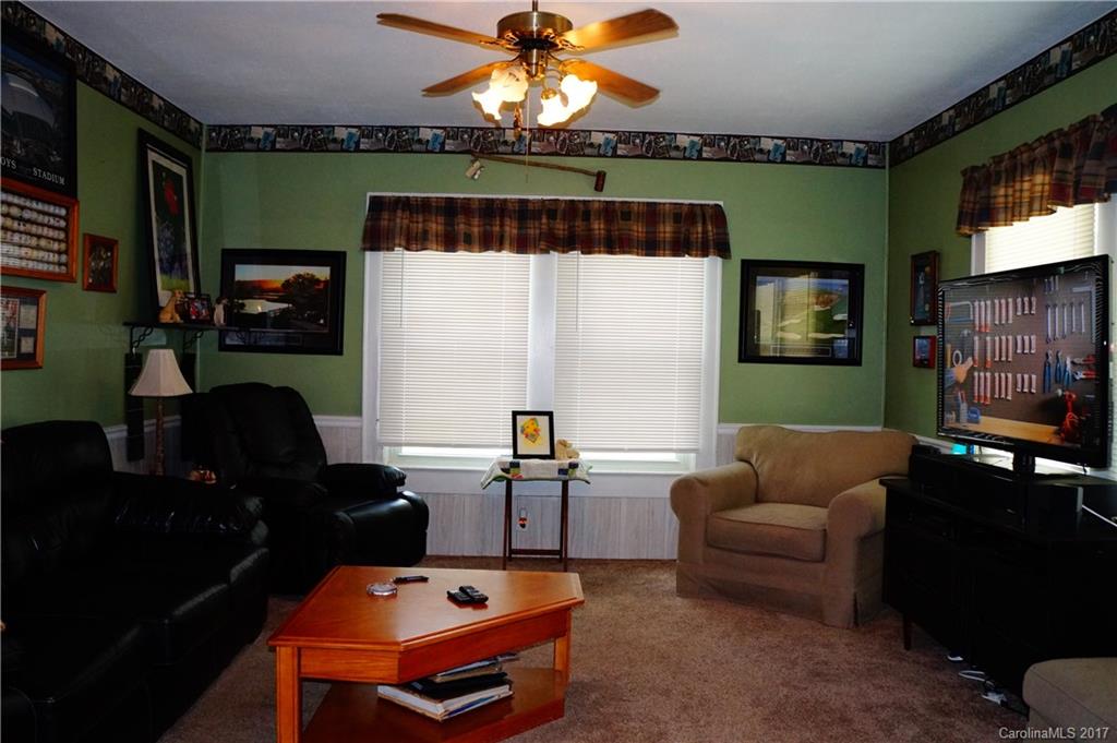1396 Springdale Road, Unit 4/A Lancaster, SC 29720 - Photo 12 of 23 a living room with furniture a window and a flat screen tv