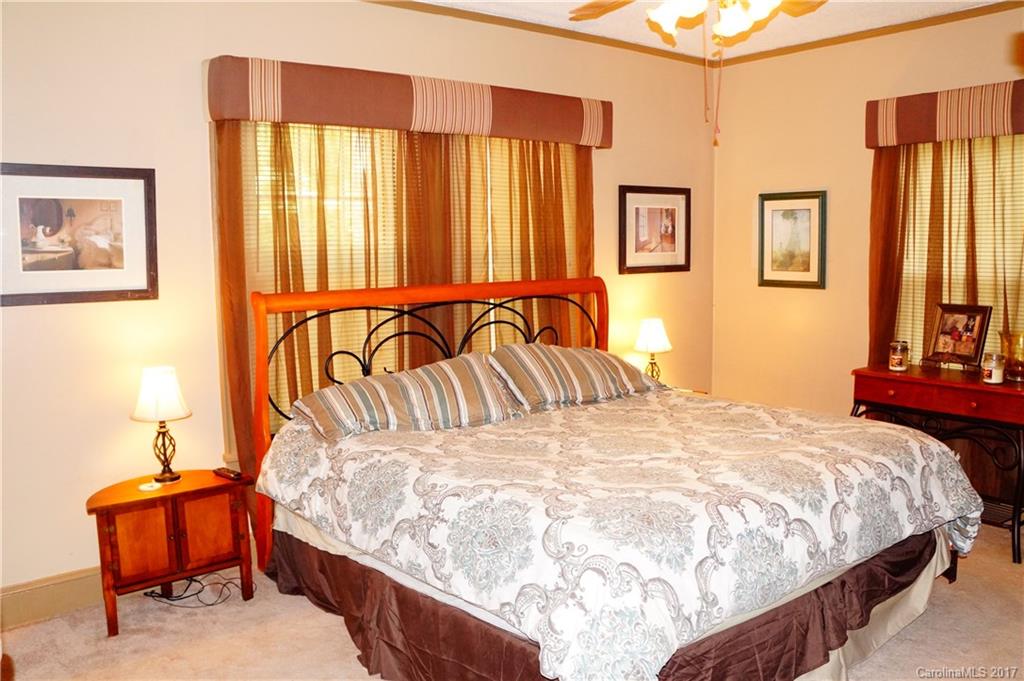 1396 Springdale Road, Unit 4/A Lancaster, SC 29720 - Photo 20 of 23 a bedroom with a bed and painting on the wall