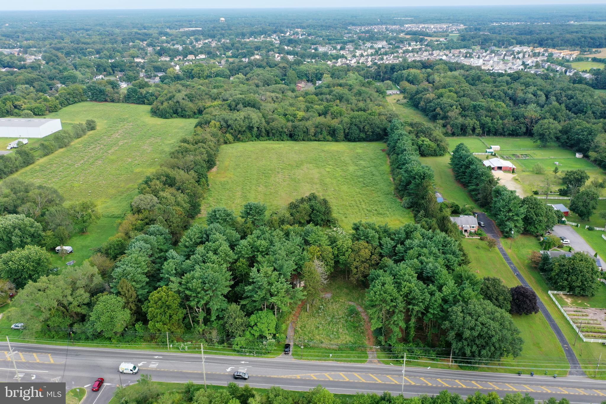 632 Clayton Road Williamstown, NJ 08094 - Photo 3 of 18 an aerial view of green landscape with trees houses and mountain view