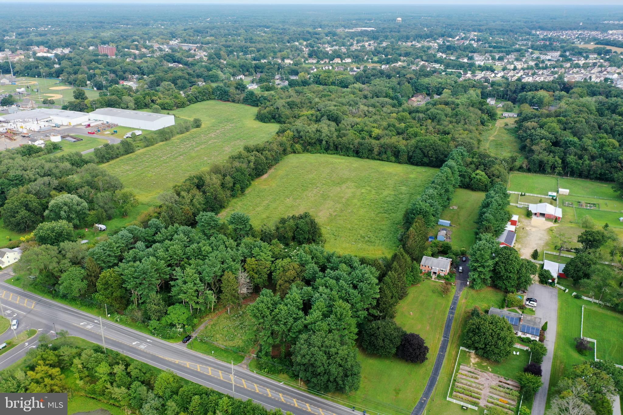 632 Clayton Road Williamstown, NJ 08094 - Photo 8 of 18 an aerial view of green landscape with trees houses and mountain view