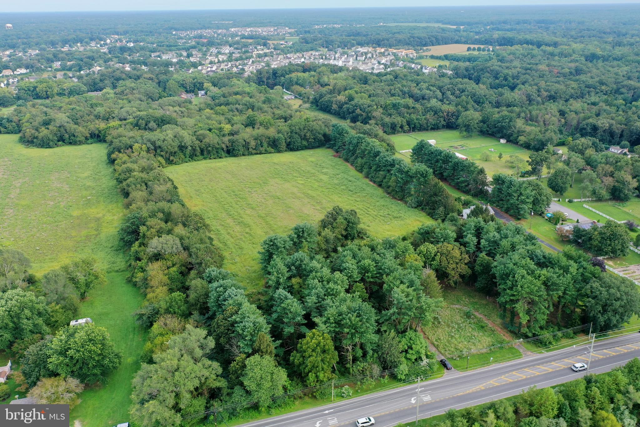 632 Clayton Road Williamstown, NJ 08094 - Photo 8 of 18 an aerial view of green landscape with trees houses and mountain view