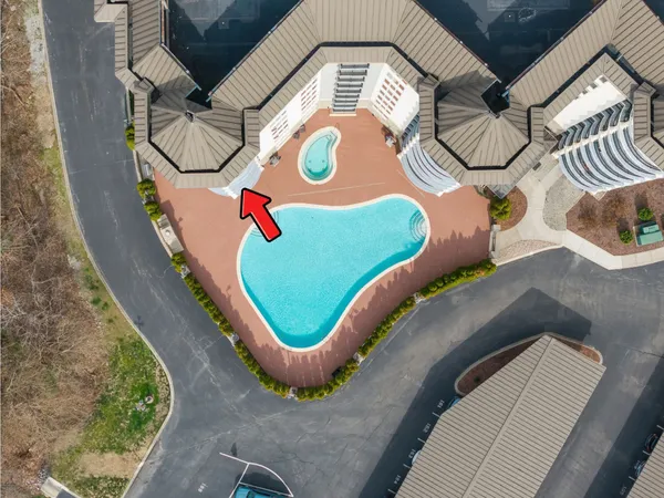 an aerial view of a swimming pool and outdoor space