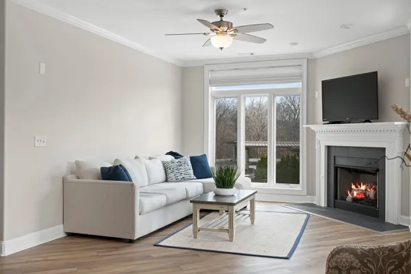 a living room with furniture and a fireplace