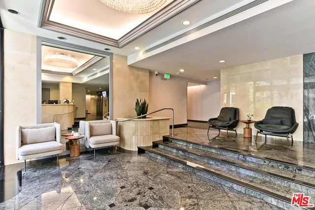 a living room with lots of furniture and a rug