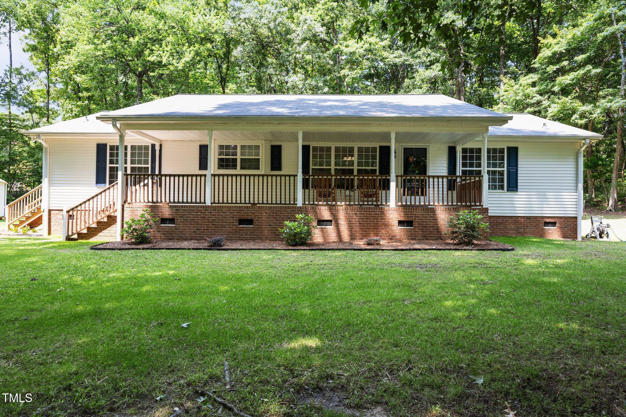 117 Lema Drive Garner, NC 27529 - Photo 1 of 34 a view of a house with a yard and sitting area