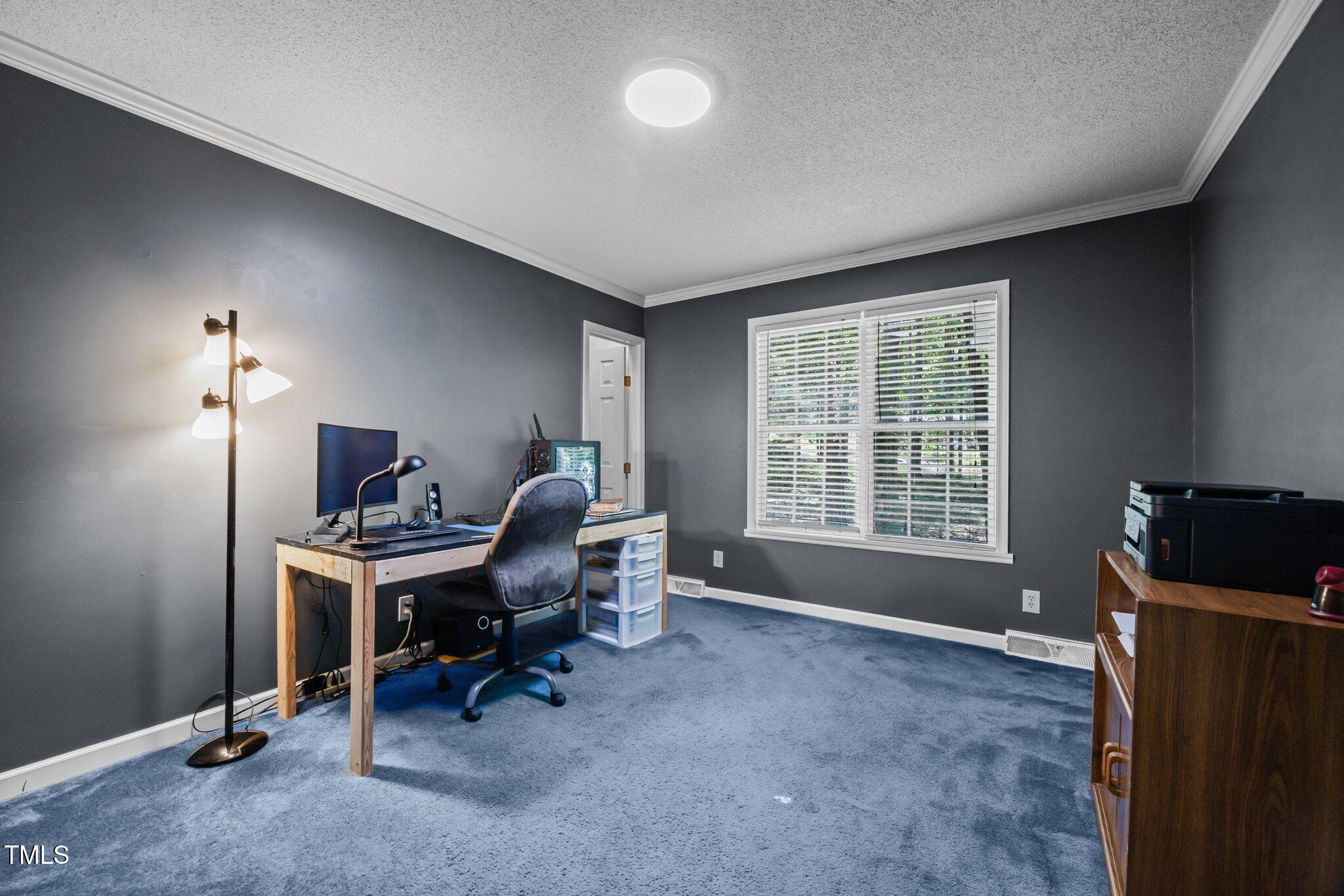 117 Lema Drive Garner, NC 27529 - Photo 25 of 34 a view of a workspace with furniture and a window