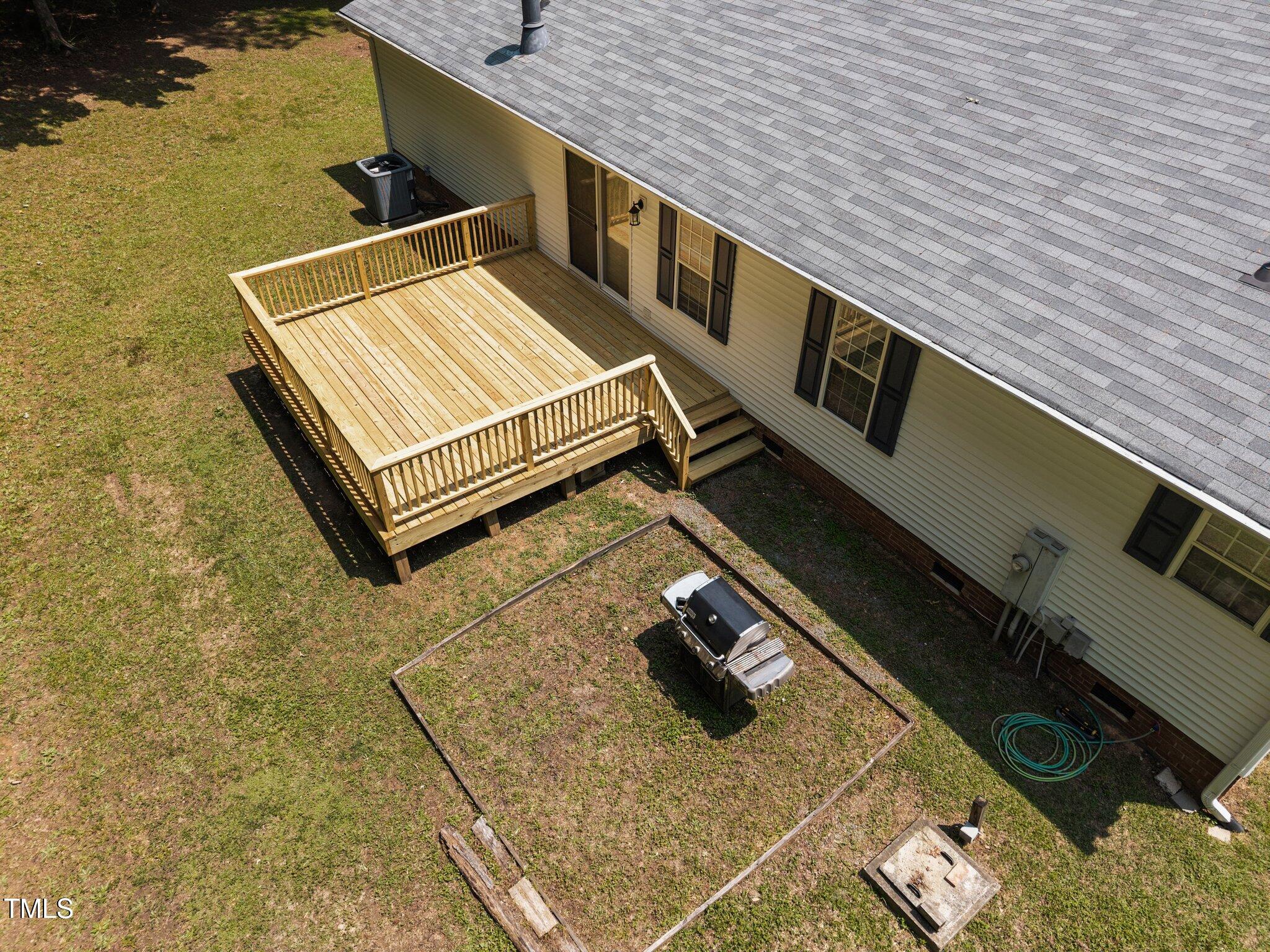 117 Lema Drive Garner, NC 27529 - Photo 27 of 34 a wooden bench sitting on top of a roof