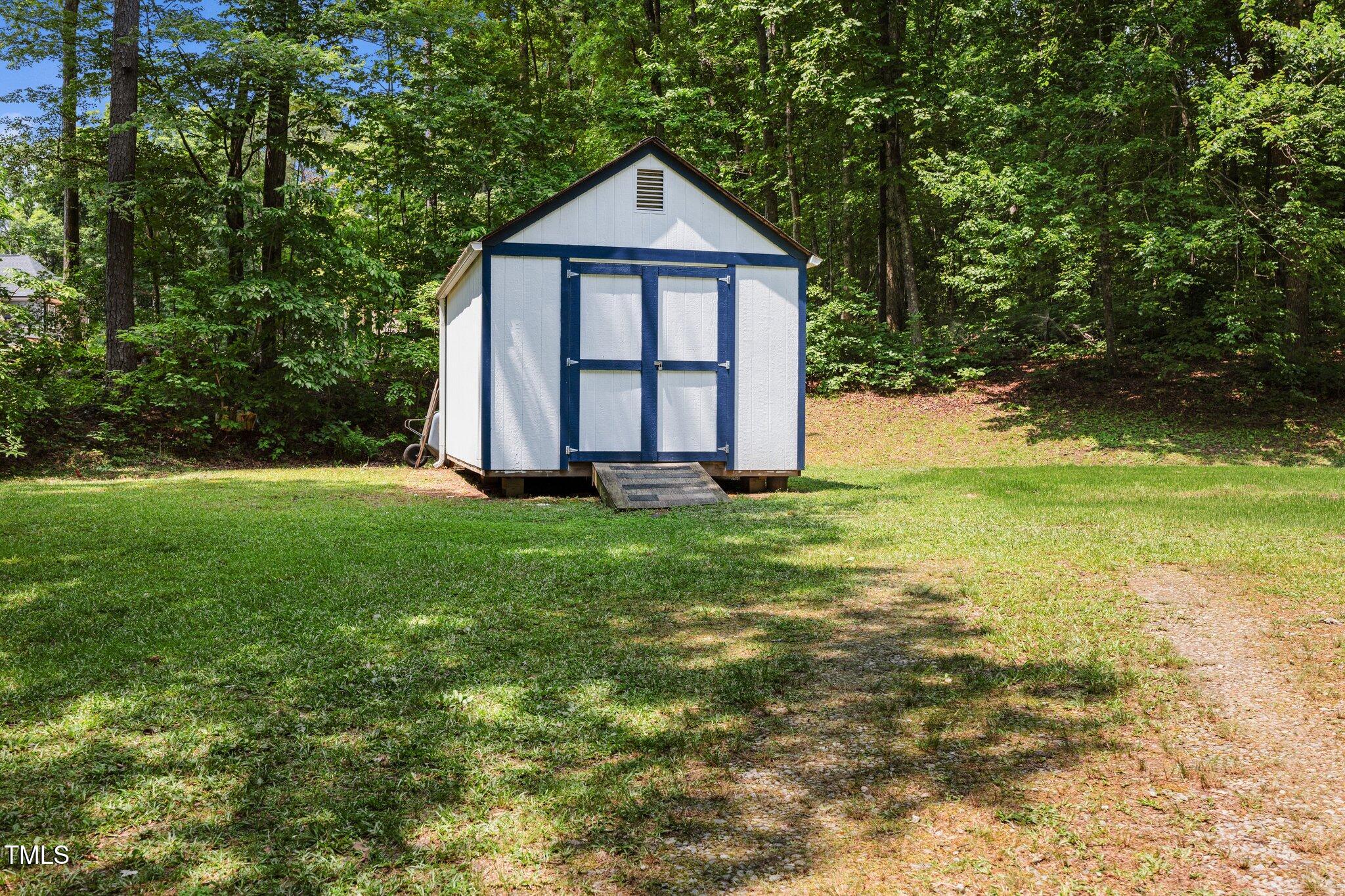 117 Lema Drive Garner, NC 27529 - Photo 29 of 34 a front view of a house with garden