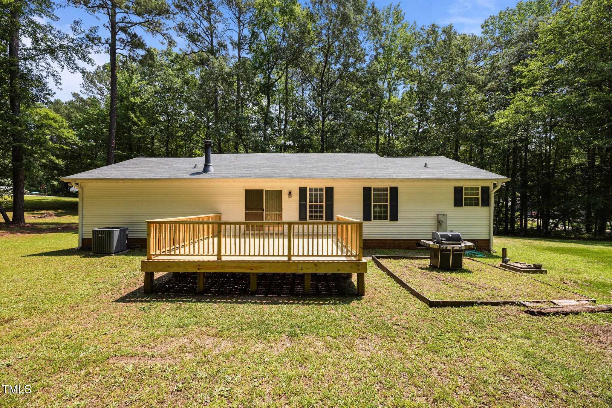 117 Lema Drive Garner, NC 27529 - Photo 31 of 34 a view of a house with backyard and sitting area