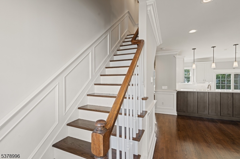 4 Central Avenue, Unit D Caldwell, NJ 07006 - Photo 11 of 32 a view of staircase with wooden floor and white walls