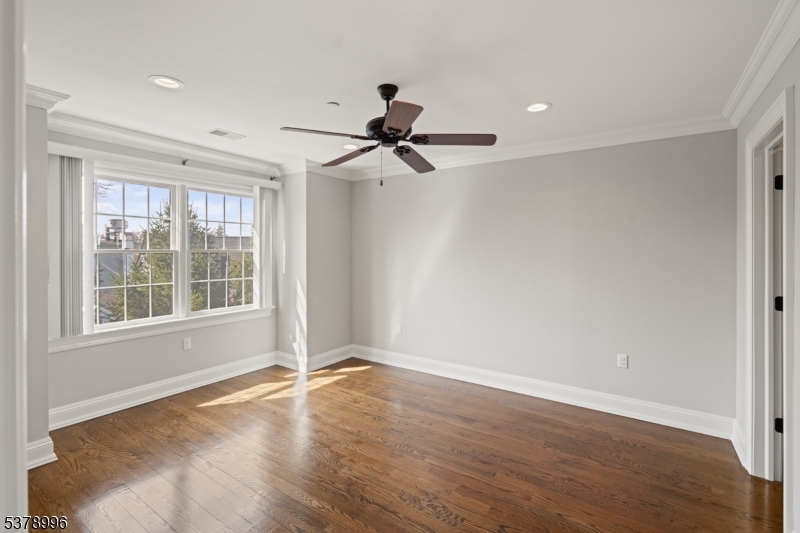 4 Central Avenue, Unit D Caldwell, NJ 07006 - Photo 14 of 32 a view of a livingroom with a ceiling fan and window