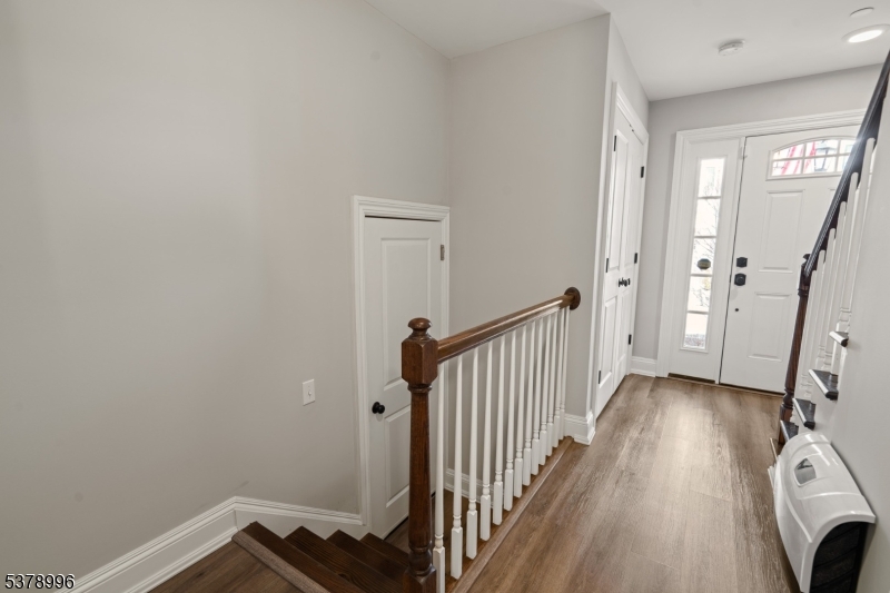 4 Central Avenue, Unit D Caldwell, NJ 07006 - Photo 19 of 32 a view of a hallway with wooden floor and staircase