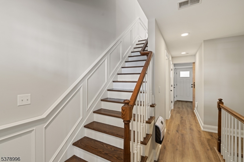 4 Central Avenue, Unit D Caldwell, NJ 07006 - Photo 21 of 32 a view of staircase with wooden floor and white walls