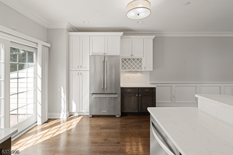 4 Central Avenue, Unit D Caldwell, NJ 07006 - Photo 5 of 32 a kitchen with a refrigerator and a sink