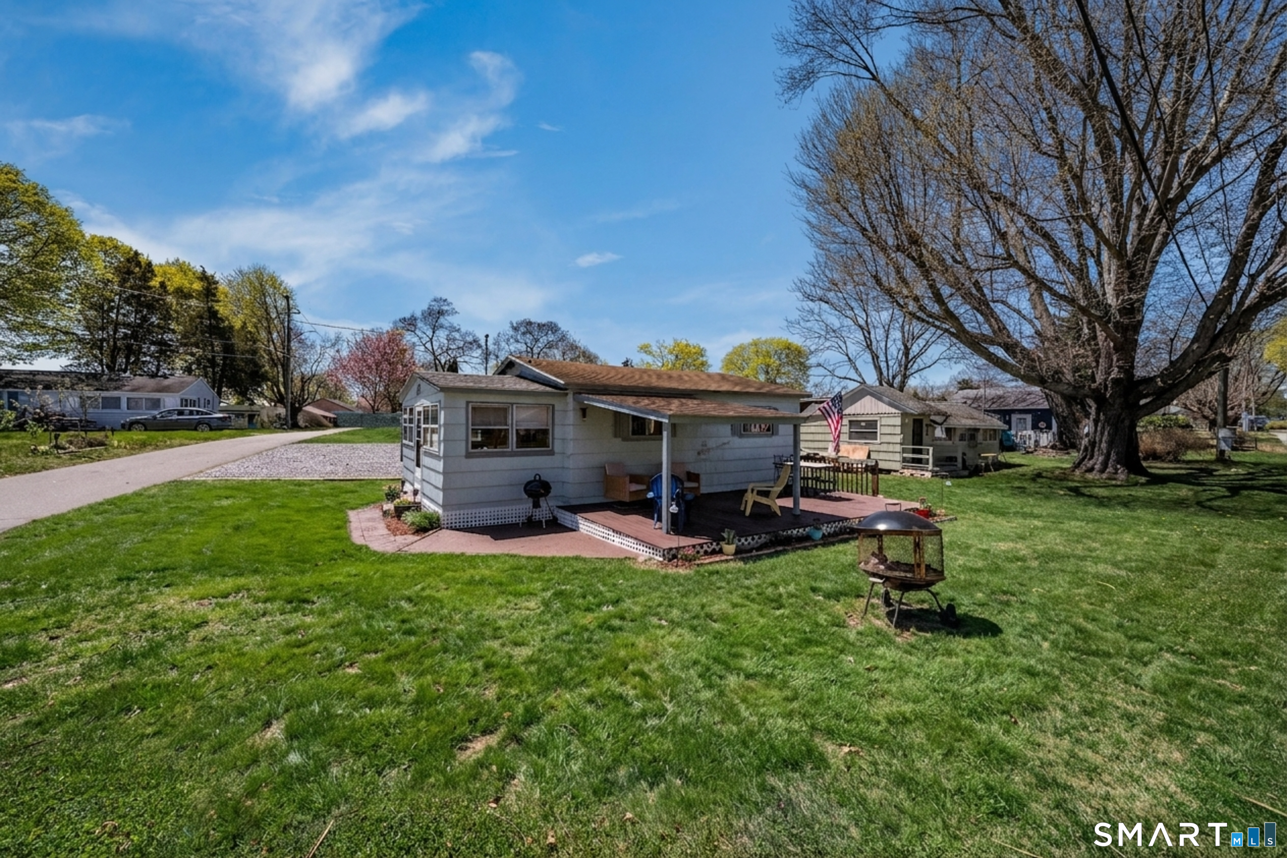 32 North Street Madison, CT 06443 - Photo 3 of 20 Generously-sized deck perfect for summer entertaining! Grass enhanced