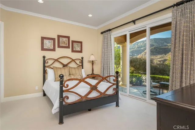a living room with furniture a fireplace and a chandelier
