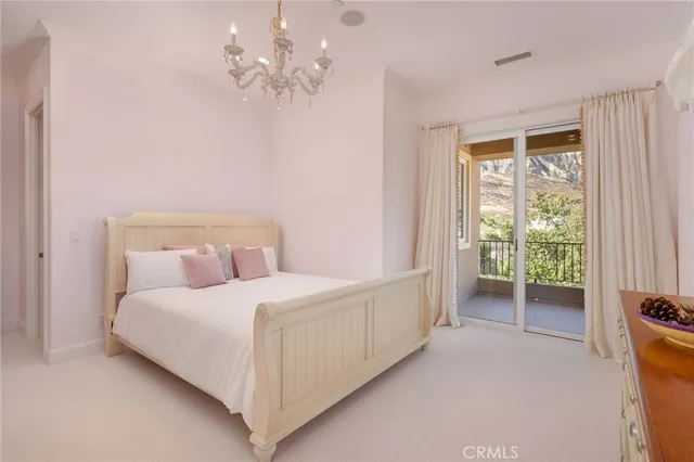 a view of swimming pool with outdoor seating and plants