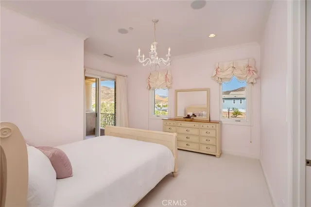 a swimming pool with outdoor seating yard and palm tree