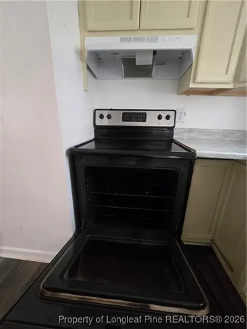 a view of a hallway and wooden floor