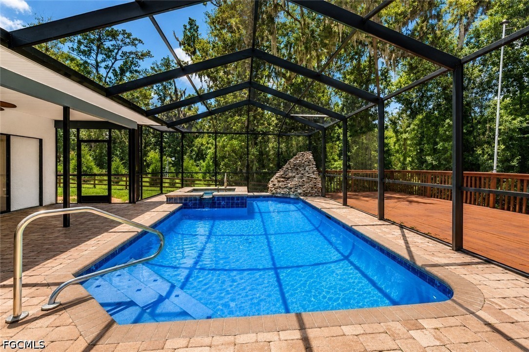 27255 Hickory Hill Road Brooksville, FL 34602 - Photo 17 of 50 a view of swimming pool with seating space