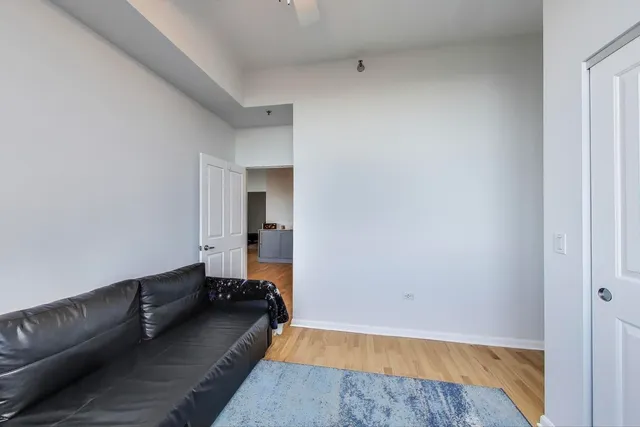 a room with a couch and a rug