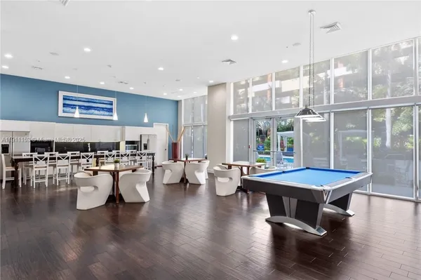 a living room with lots of furniture and white walls