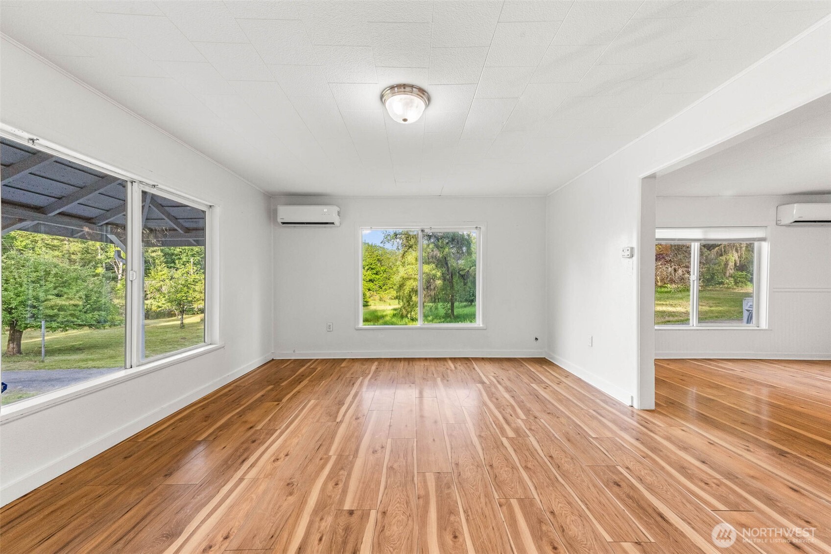 172 South Bank Road Elma, WA 98541 - Photo 19 of 40 a view of room with window and wooden floor
