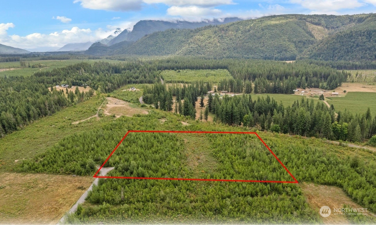 9250 Heady Road Sumas, WA 98295 - Photo 1 of 7 a view of a lake with a mountain in the back
