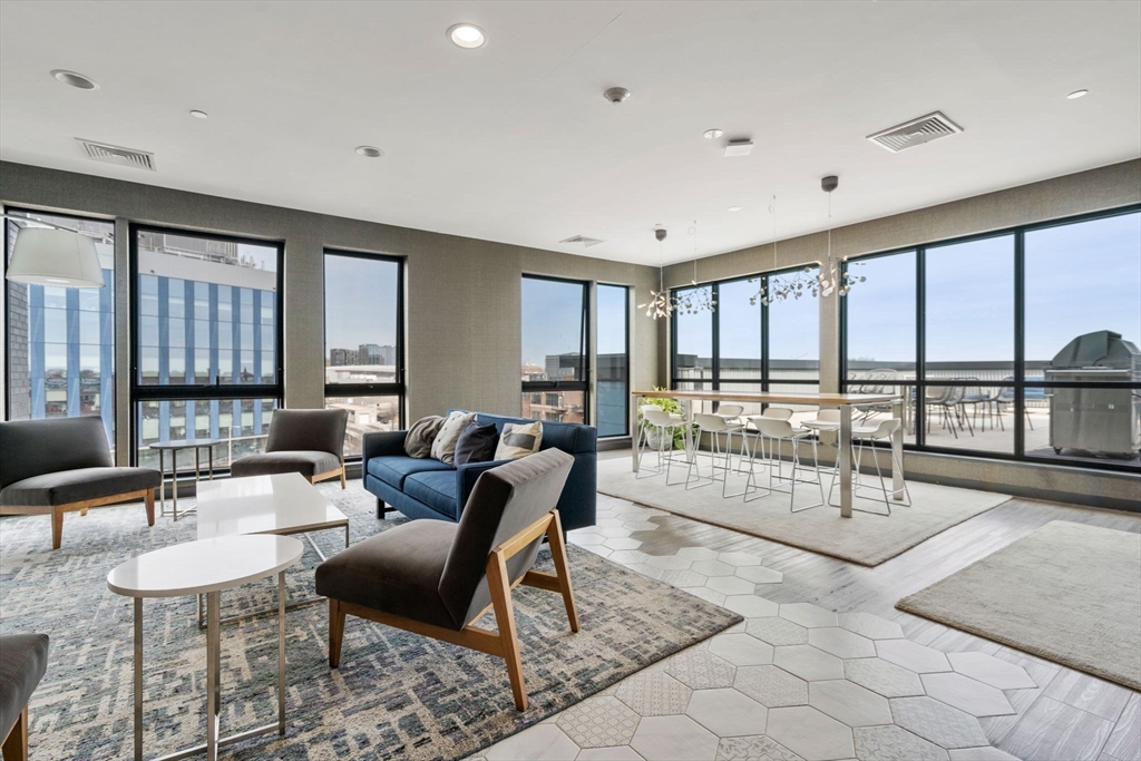 45 West 3rd Street, Unit 409 Boston, MA 02127 - Photo 24 of 30 a living room with furniture and a large window