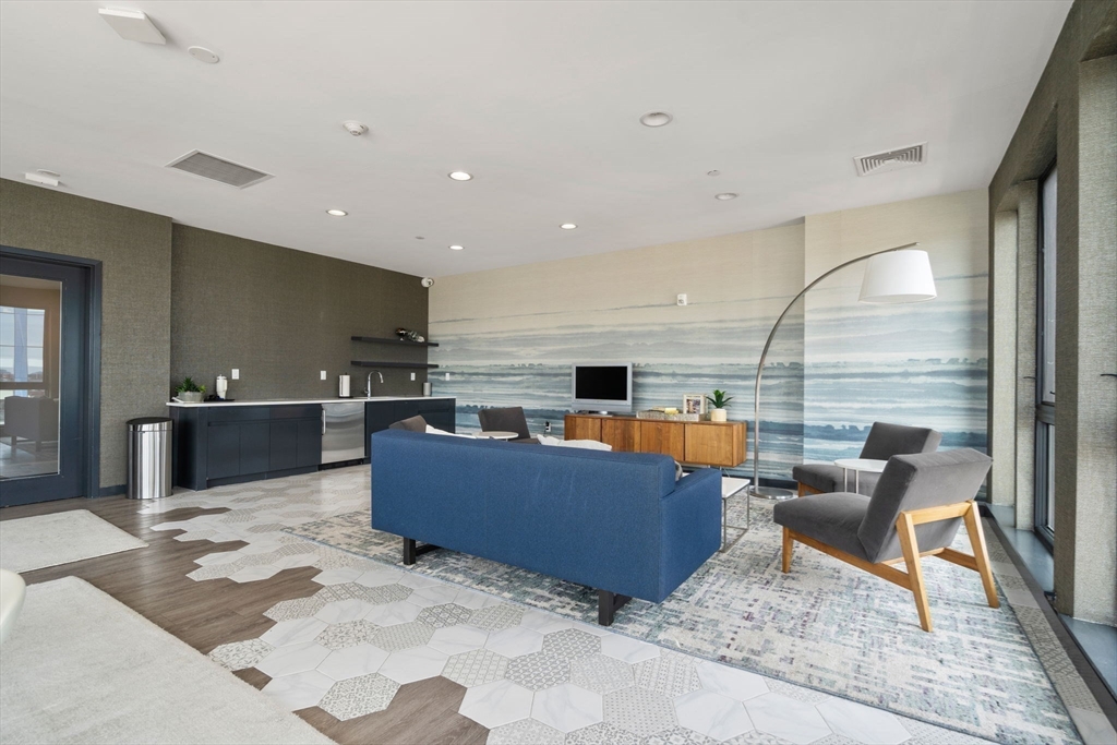 45 West 3rd Street, Unit 409 Boston, MA 02127 - Photo 25 of 30 a living room with furniture and kitchen view