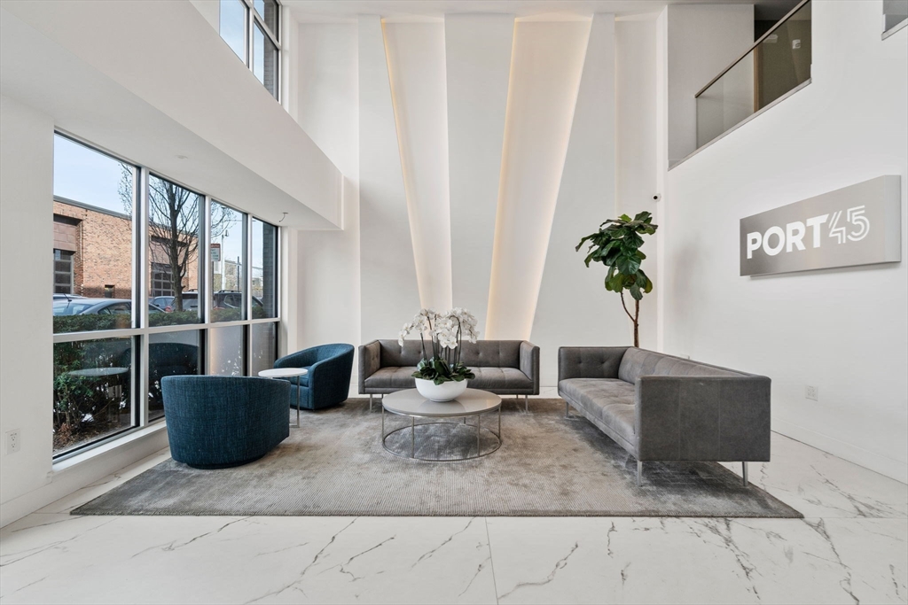 45 West 3rd Street, Unit 409 Boston, MA 02127 - Photo 28 of 30 a living room with furniture and a potted plant