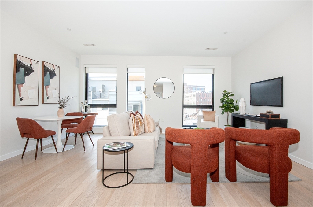 45 West 3rd Street, Unit 409 Boston, MA 02127 - Photo 30 of 30 a view of a livingroom with furniture and a flat screen tv