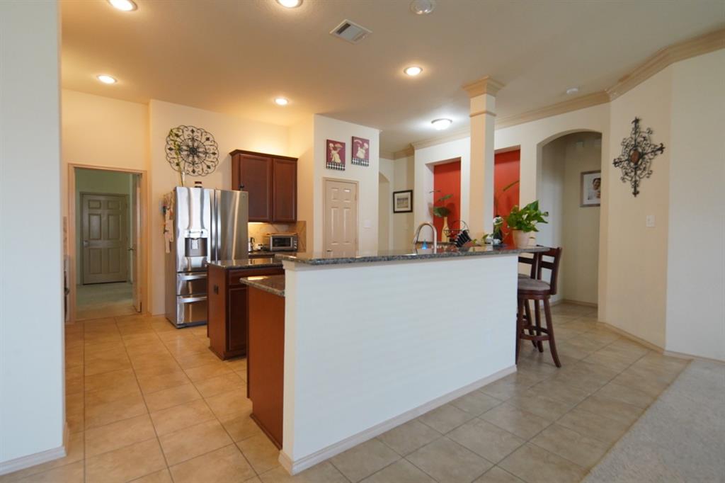 4508 Fox Rio Trail Arlington, TX 76017 - Photo 26 of 28 a view of a kitchen with furniture and refrigerator