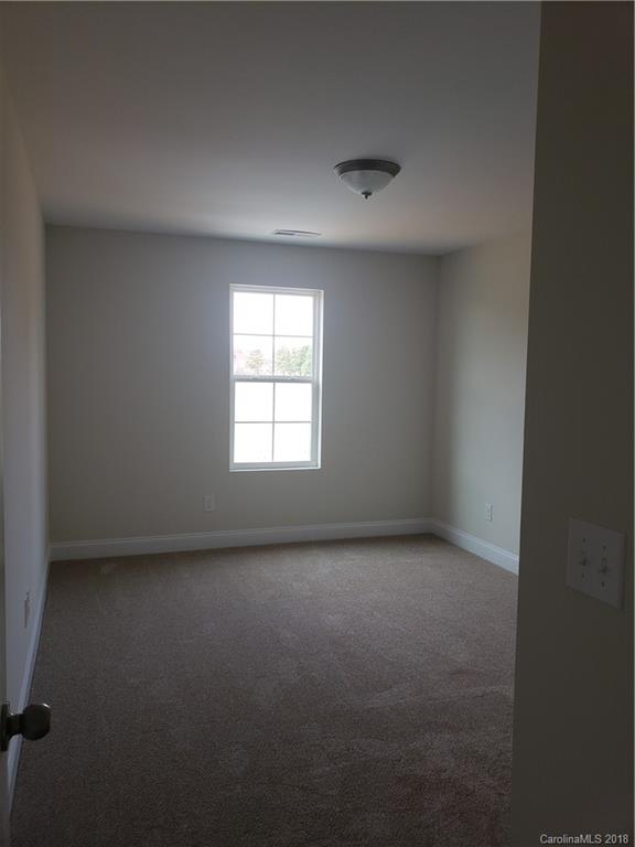 4220 Sincerity Road, Unit 4 Monroe, NC 28110 - Photo 13 of 23 an empty room with a window