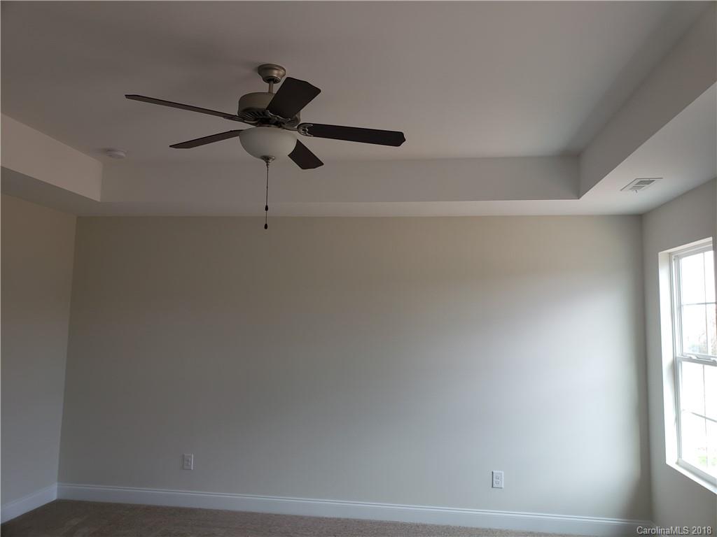 4220 Sincerity Road, Unit 4 Monroe, NC 28110 - Photo 15 of 23 a view of a decorative light in a room