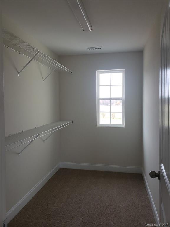 4220 Sincerity Road, Unit 4 Monroe, NC 28110 - Photo 17 of 23 an empty room with a window