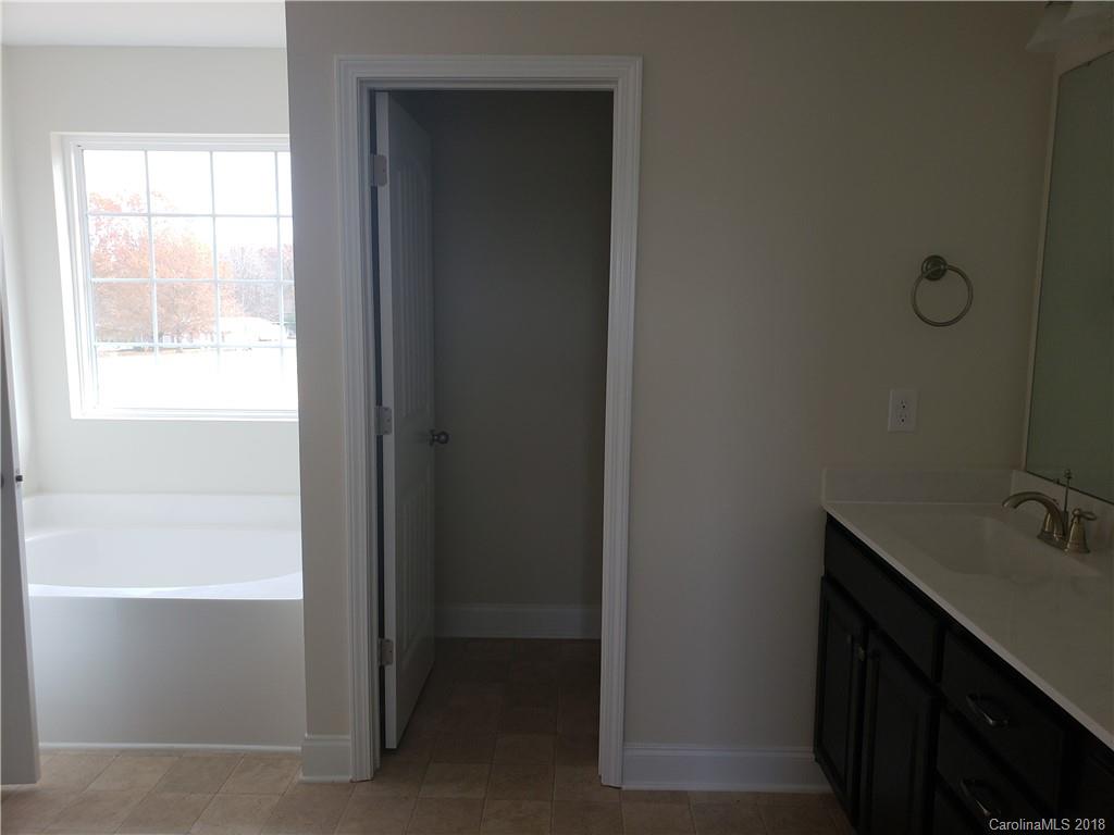 4220 Sincerity Road, Unit 4 Monroe, NC 28110 - Photo 18 of 23 a bathroom with a sink and a window