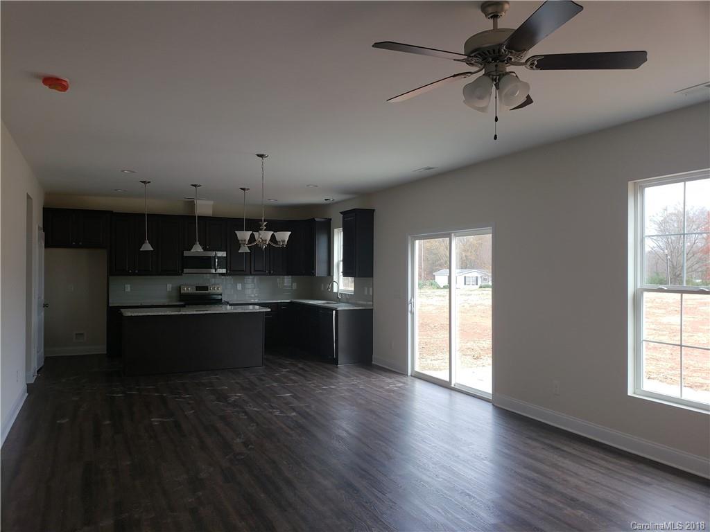 4220 Sincerity Road, Unit 4 Monroe, NC 28110 - Photo 4 of 23 a large kitchen with a window and stainless steel appliances