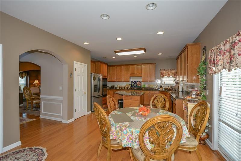 172 Villa Pl Court Tucker, GA 30084 - Photo 11 of 18 a very nice looking dining room with furniture and wooden floor