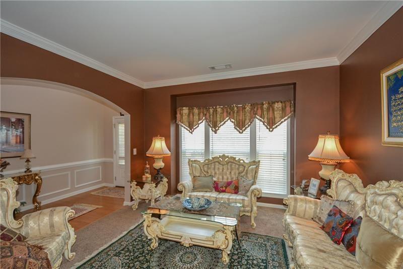 172 Villa Pl Court Tucker, GA 30084 - Photo 12 of 18 a living room with furniture and a large window