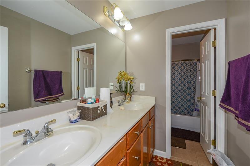 172 Villa Pl Court Tucker, GA 30084 - Photo 13 of 18 a bathroom with a double vanity sink mirror and shower