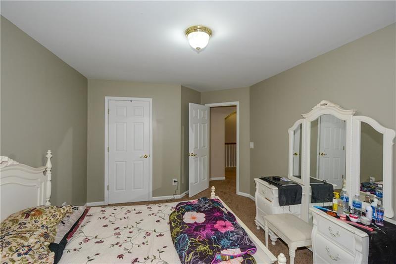 172 Villa Pl Court Tucker, GA 30084 - Photo 14 of 18 a bedroom with bed and a mirror