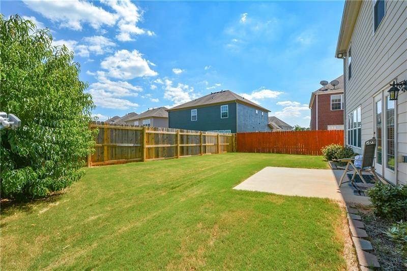172 Villa Pl Court Tucker, GA 30084 - Photo 17 of 18 a front view of a house with a yard