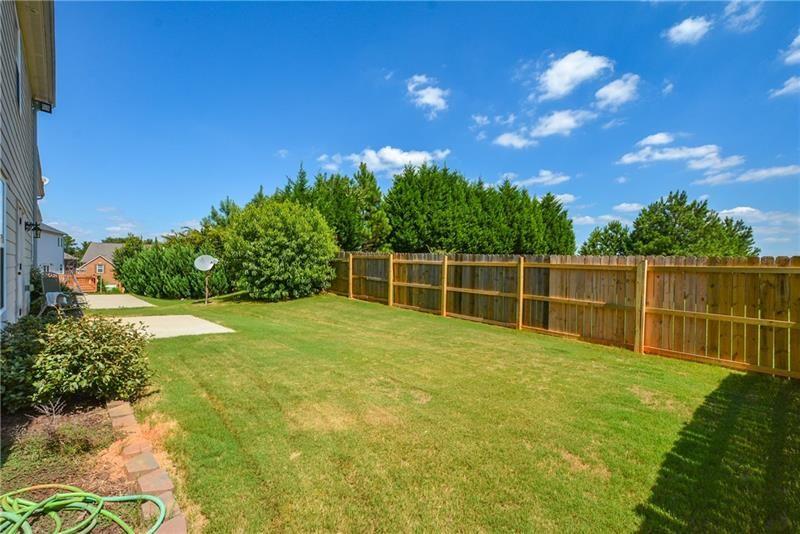 172 Villa Pl Court Tucker, GA 30084 - Photo 18 of 18 a view of a yard with potted plants and tree