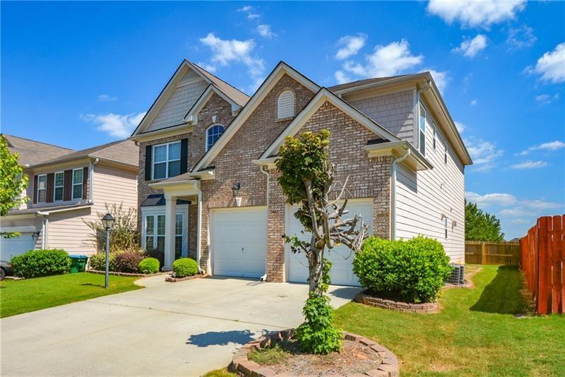 172 Villa Pl Court Tucker, GA 30084 - Photo 2 of 18 a front view of a house with a yard