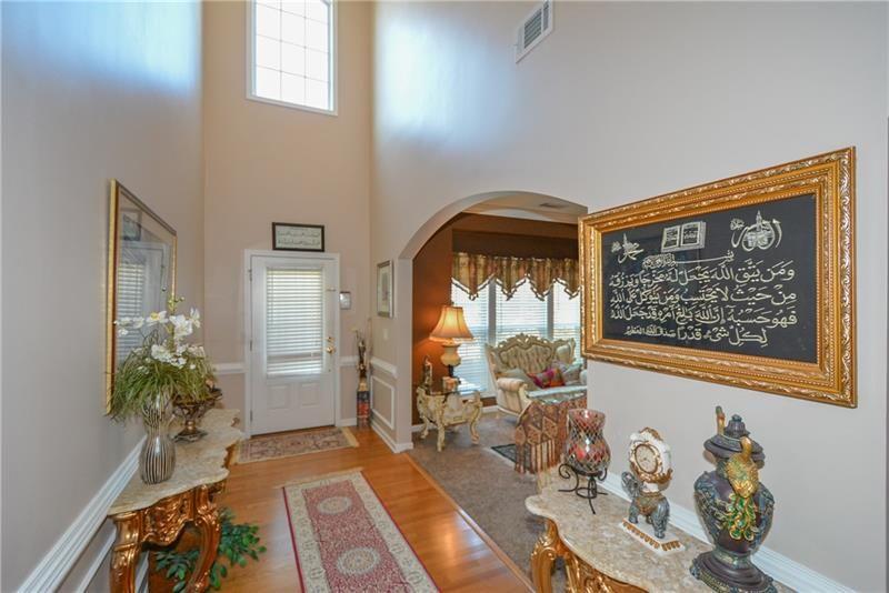 172 Villa Pl Court Tucker, GA 30084 - Photo 4 of 18 a living room with furniture and flowers