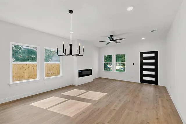 a view of an empty room with a window