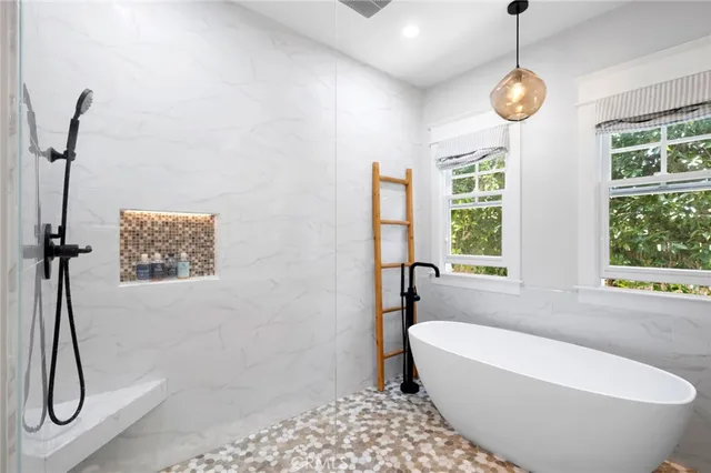 a view of backyard of house with seating space