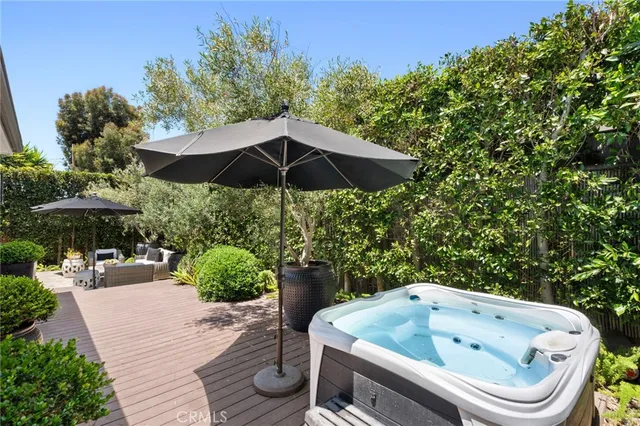 a bathroom with a tub a sink and a large window